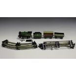 A Hornby gauge O No. 30 clockwork goods train set, comprising 0-4-0 locomotive, tender, two trucks