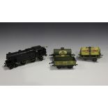 A Hornby gauge O clockwork 4-6-2 tank locomotive, repainted in black, a tanker 'United Dairies',