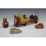 A tinplate clockwork porter and trolley, length 30cm, a Schuco felt covered clockwork mouse, a