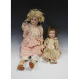 A Simon & Halbig bisque head doll, impressed '126 36', with brown wig, blue closing follow-me-