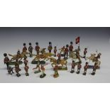 A collection of Tipple-Topple and Lineol Native American and cowboy figures, a Canadian Mountie