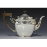 A George V silver teapot of tapered cushion form with gadrooned rim, Sheffield 1926 by Martin Hall &