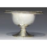 A sterling footed bowl with pierced outswept rim, decorated in relief with a bellflower garland