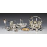 An Edwardian silver cream jug, Chester 1909 by Barker Brothers, a plated six-egg cruet stand and a