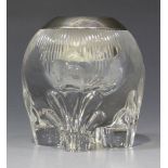 A late Victorian silver mounted cut glass globular match strike, raised on four feet with moulded