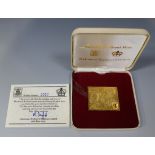 A 22ct gold replica postage stamp ingot commemorating 'Universal Postal Union 1874-1974', within a