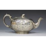 A Victorian silver teapot, the squat circular body engraved with strapwork, the hinged lid with