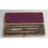 A late Victorian silver three-piece writing set with spiral reeded handles, comprising a dip pen,