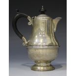 A George V silver coffee pot of baluster form, on a circular foot, Birmingham 1931 by Marson &