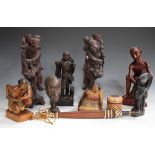 A group of mainly 20th century carved hardwood figures, including two Chinese hardwood sages, a pair