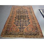 A Ghashghai rug, South-west Persia, late 19th century, the blue field profusely decorated with