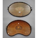 An Edwardian mahogany oval tea tray, inlaid with an oval conch shell patera, width 61cm, together
