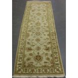 An Afghan 'Ziegler' style runner, late 20th century, the ivory field with overall vines issuing