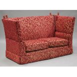 A 20th century Knole style settee, upholstered in red patterned velour, height 113cm, length