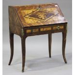 A 20th century French marquetry inlaid yew and maple bureau, the fall flap above two frieze drawers,
