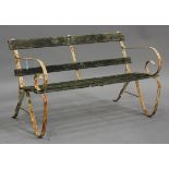 A 20th century white painted wrought iron garden bench with slatted wooden seat and back, height