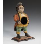 A cast iron novelty clock case in the form of a portly gentleman wearing a bicorn hat, height