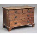 A George III oak chest of two short and two long drawers, on bracket feet, height 78cm, width 111cm,