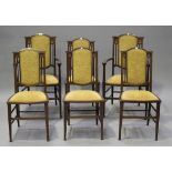 A set of six Edwardian mahogany and inlaid dining chairs, comprising two carver and four standard,