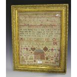 A late George III needlework sampler by Helen Elsmie, dated 1816, worked with bands of letters and