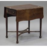 A George III mahogany butterfly Pembroke table, the hinged top above a single frieze drawer,