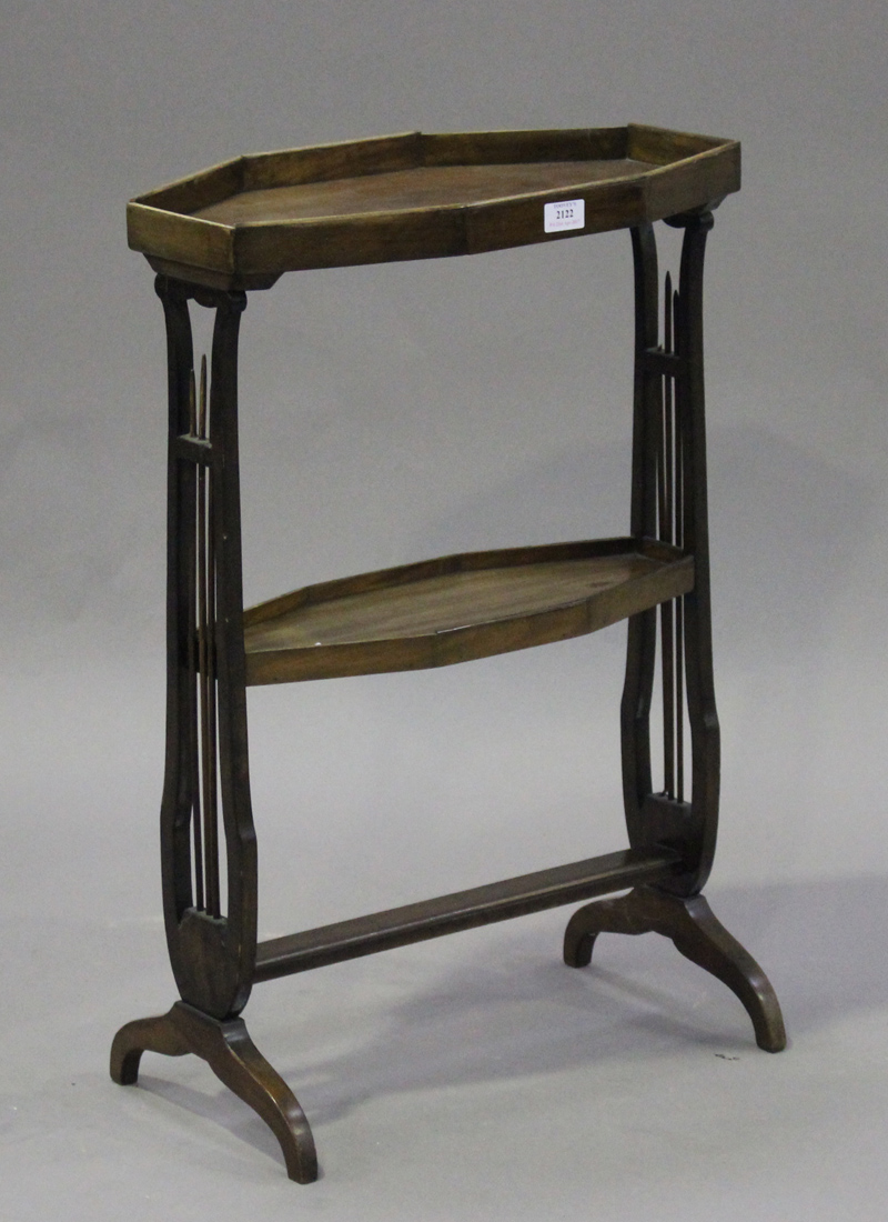 A late 19th century mahogany two-tier octagonal stand, raised on lyre supports with cabriole legs,
