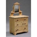 A late Victorian stripped pine dressing chest of two short and two long drawers, fitted with a swing