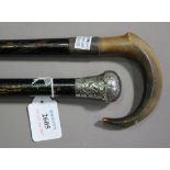 An early 20th century silver handled walking stick, London 1917, length 89cm, together with a horn