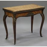 A 19th century French kingwood fold-over card table with gilt metal mounts, the hinged serpentine