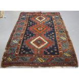 A Kazak rug, West Caucasus, late 19th/early 20th century, the midnight blue field with a central