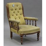 A late Victorian stained beech gentleman's armchair, upholstered in golden striped velour, on turned