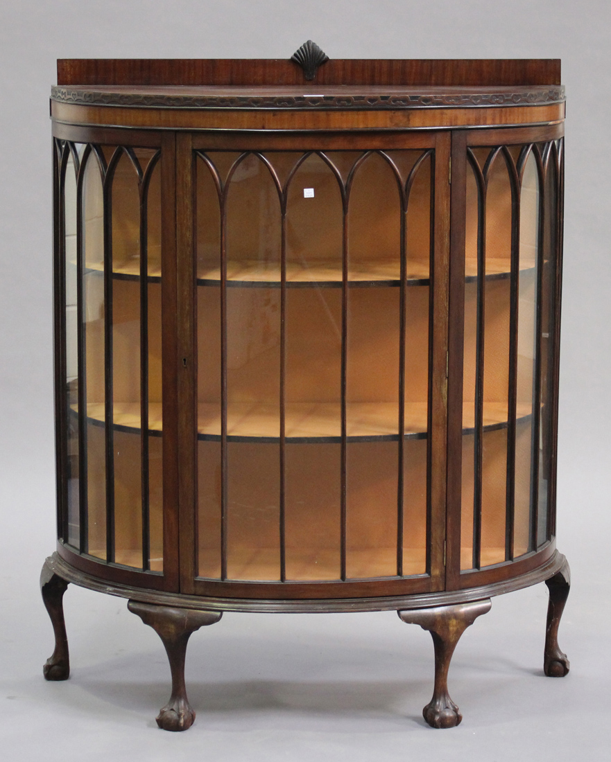 A George V walnut demi-lune display cabinet, raised on cabriole legs and claw and feet, height