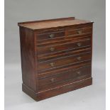 An Edwardian walnut chest of two short and three long drawers, raised on a plinth base, height