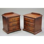 A 20th century reproduction hardwood bedroom suite, retailed by Harrod's, comprising a chest of