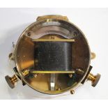 An early 20th century gilt lacquered brass cased galvanometer by H.W. Sullivan, within a leather