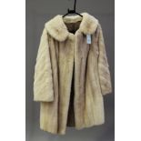 A mid-20th century silver fox fur half-length coat, possibly retailed by Harrods, length 85cm,