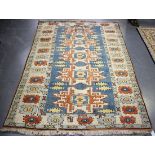 A Turkish Lesghi design rug, mid-20th century, the blue field with five shaped medallions, within an