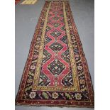 A Garabagh runner, South-east Caucasus, early 20th century, the claret field with a single column of