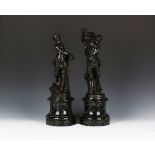 A pair of late 19th/early 20th century Continental brown patinated cast bronze figures of a satyr