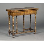 An 18th century and later walnut rectangular fold-over tea table, the hinged top revealing a well,