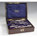 A late Victorian nickel and ivory mounted drawing instrument set by A.G. Thornton, within a rosewood