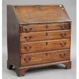 A George III oak bureau, the fall front above four graduated long drawers, on bracket feet, height