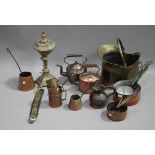 A collection of copper and brassware, including a table lamp, a warming pan, two Victorian kettles