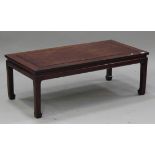 A late 20th century Chinese hardwood rectangular coffee table, raised on block legs, height 43cm,