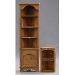 An early 20th century pine corner bookshelf, height 186cm, width 57cm, together with a pine