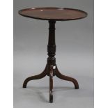 A 19th century mahogany and stained beech circular wine table, the dished top on a turned column and