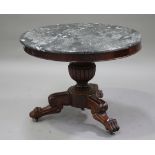 A 19th century French mahogany and grey marble circular centre table, raised on a turned and