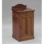An Edwardian mahogany and satinwood crossbanded bedside cabinet by Howard and Sons Ltd, fitted