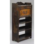 An early 20th century student's pokerwork bureau, the fall front above shelves, on stile supports,