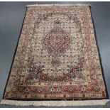 A Birjand rug, North-east Persia, late 20th century, the ivory field with an oval medallion,